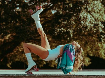 Active individual performing balance poses outdoors