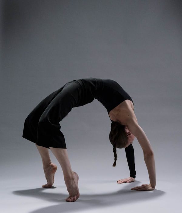 Person practicing gentle yoga movements for daily balance